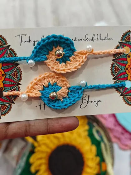 A close-up of my crochet rakhis, designed to be cute, colorful, and full of charm. These are reusable and made with so much love.