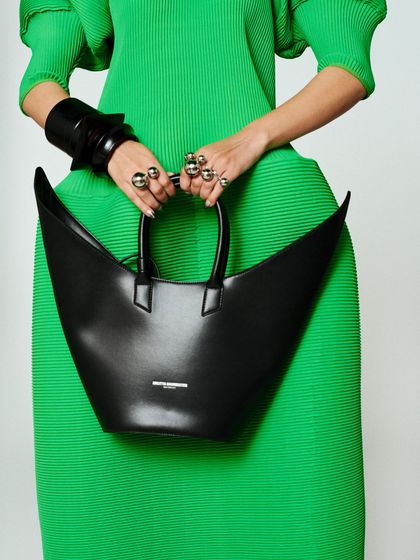 The accessories were key. This uniquely shaped bag by Melitta Baumeister perfectly complemented the architectural dress.