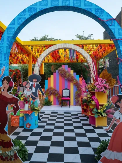 The entrance to the carnival, with rainbow arches and cartoon cutouts, creating a fun and immersive experience from the very first step.