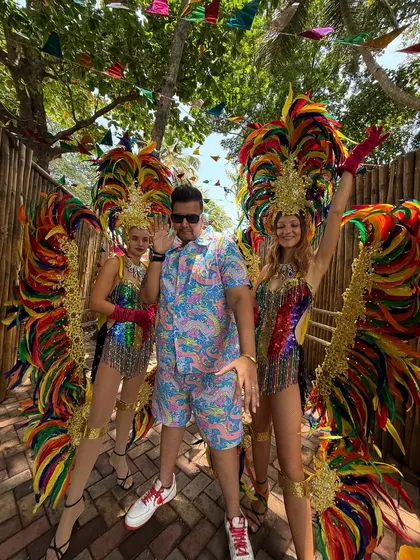 Posing with carnival dancers in Goa. Bringing the tropical beats and bold vibes to a colorful celebration.