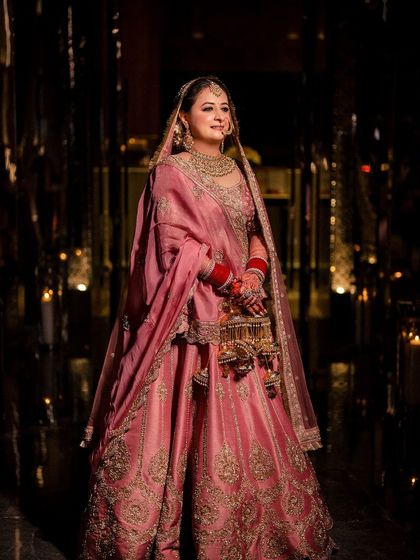 Rishika, a vision in pink. Her HD makeup was designed to look flawless both in person and in these stunning professional shots.