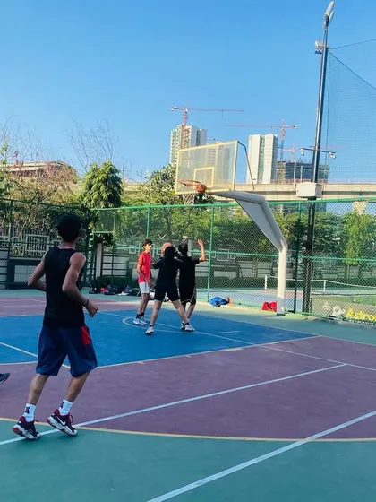 A player attempts a jump shot over a defender, a situation we simulate often in practice.