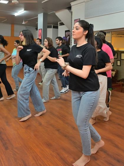Students practicing their solo footwork, or 'shines', in unison. This is a great way to build rhythm and confidence before dancing with a partner.