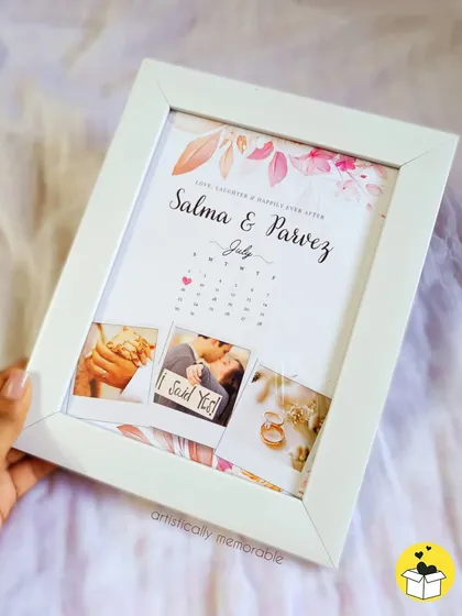 Celebrate your special date with a personalized calendar frame. This design combines your favorite photos with a calendar marking your engagement or anniversary, creating a timeless keepsake of your love story.