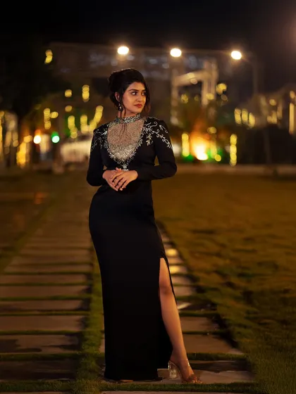 Capturing the perfect moment under the lights. This outdoor evening shot of actress Sanjanaa Anand shows my approach to event and lifestyle photography, using ambient lighting to create a moody and elegant portrait.