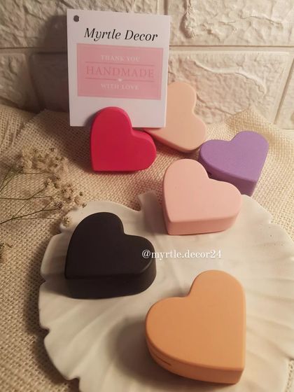 A collection of our heart photo holders in various solid colors like black, red, pink, and purple. These are perfect for wedding favors or friendship gifts.