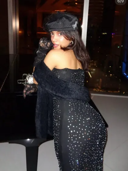 Another angle of the black sequin gown, showing off its sparkle and fit. We focus on finding silhouettes that are flattering and make you feel incredible from every angle.