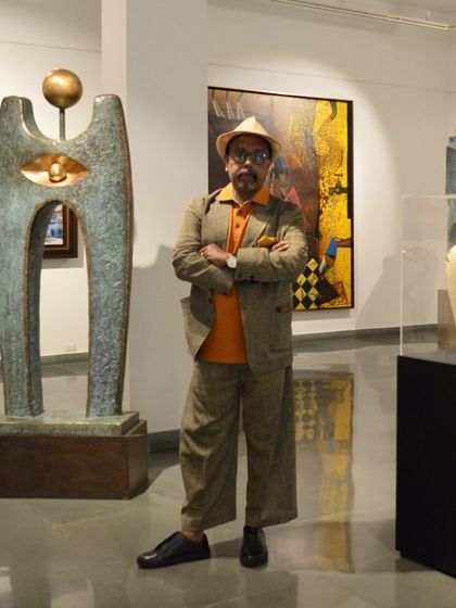 Celebrating artist Paresh Maity's birthday. Here he is in the gallery, standing next to a striking bronze sculpture.