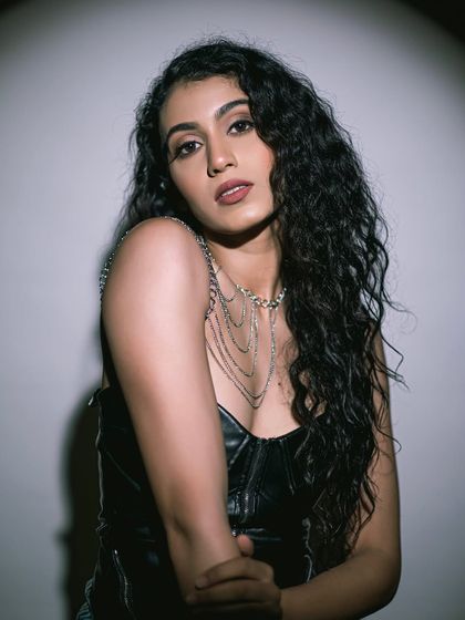 A color portrait from a fashion shoot. The makeup features a bold lip and defined eyes, perfect for this edgy look.