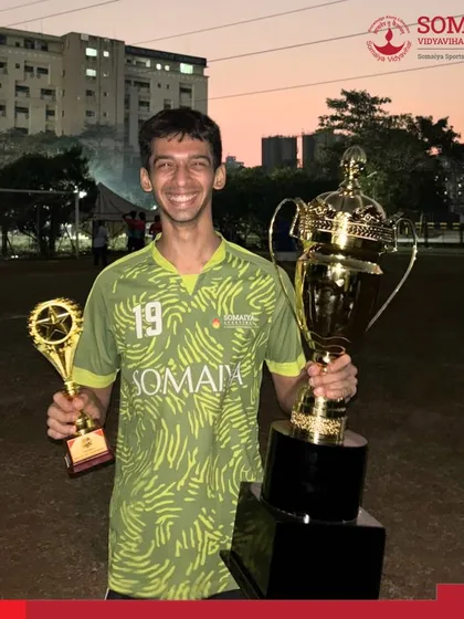 We believe in celebrating both team victories and individual brilliance. Here, a player is recognized with the Player of the Tournament and the championship trophy at the Vanquish 2026 football event.