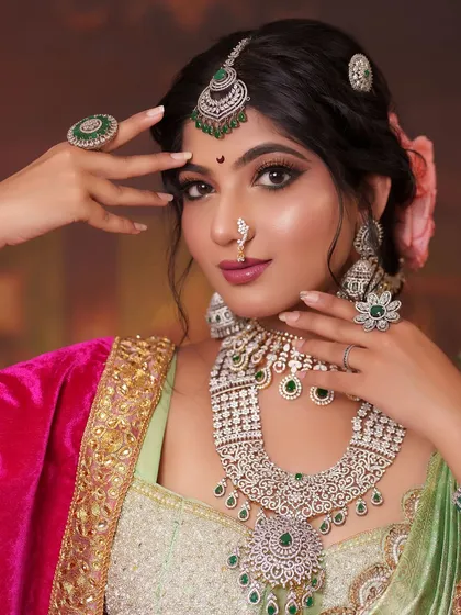 Embodying the spirit of a regal Maharashtrian queen. This look features intricate diamond and emerald jewelry, including a statement necklace and maang tikka, perfectly complementing the rich Peshwai-style attire for a powerful character portrayal.