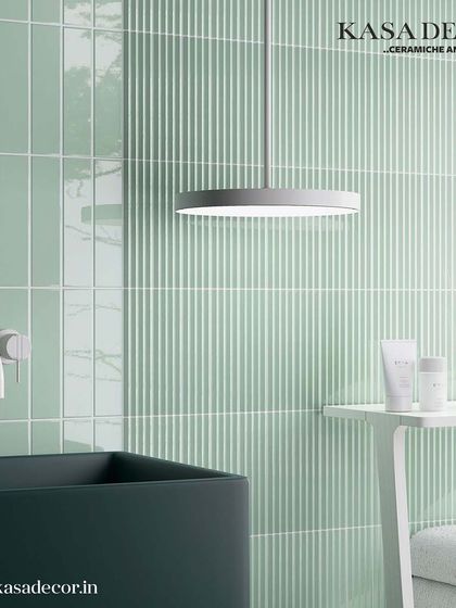 Our 'Costa Nova' fluted tiles in a serene mint green, used here in a bathroom setting. The texture adds a subtle decorative element while maintaining a clean, fresh, and modern aesthetic.