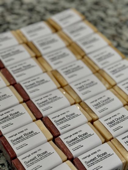 The finished and labeled Sweet Rose and Haldi Doodh mini soaps, ready to be gifted at a 75th birthday party in Pune.