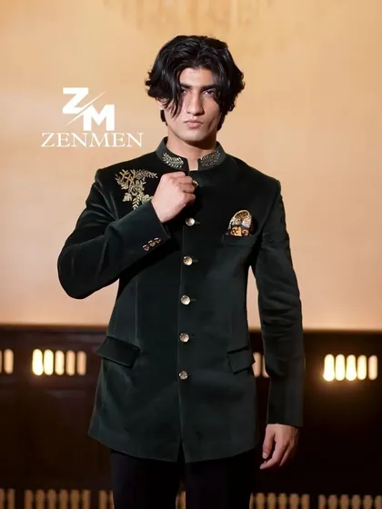 A confident pose in the emerald velvet bandhgala. This piece is designed for a man who appreciates timeless style with a touch of opulence.
