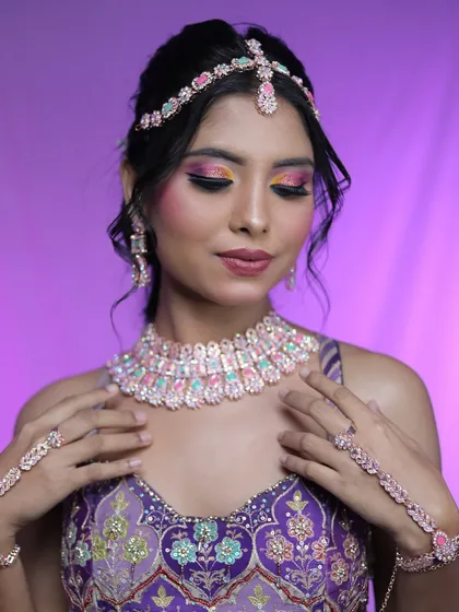 Another angle of the colorful eye makeup, showing the blend of yellow and pink eyeshadow.