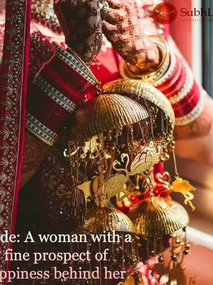 Another beautiful shot focusing on a bride's hands holding her kalire, with the intricate henna and bridal choora visible. These details complete the perfect bridal look.