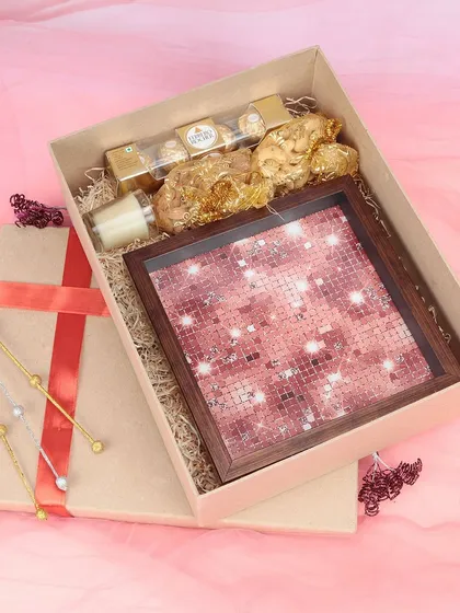 We capture the appeal of festive and luxury gift hampers. This photograph of a gift box containing chocolates and a decorative tray is styled to evoke a sense of celebration, perfect for seasonal marketing campaigns.