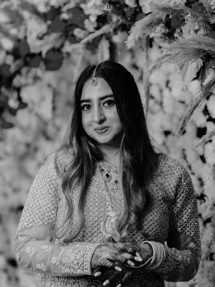 A stunning black and white portrait of a Muslim bride, capturing her goddess-like poise and elegance.