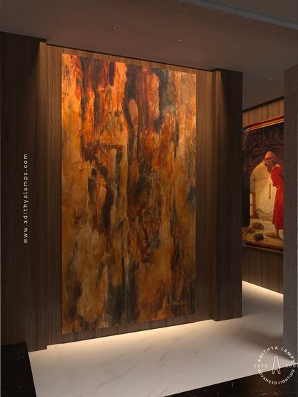 Our 'Teros' downlight, a form of recessed profile light, is used here to create a seamless wall washing effect. The light emanates from a nearly invisible source at the base of the wall, beautifully illuminating a large piece of abstract art.