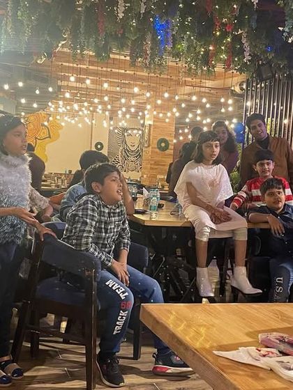 A group of kids gathered around, completely focused on the magic show. This is the level of engagement I bring to every performance.