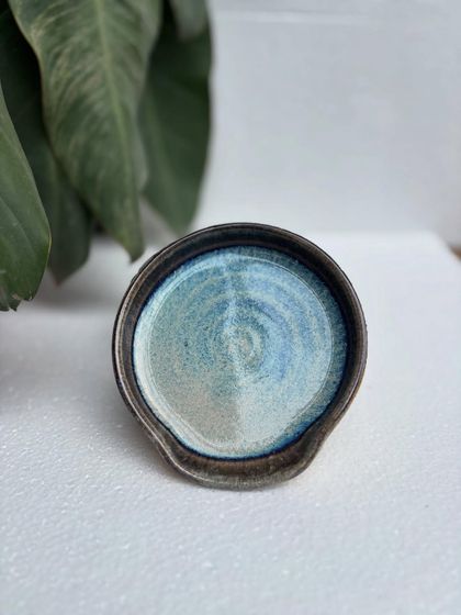 This spoon rest features our drippy Rutile glaze, which is all the rage right now. The combination of blues and earthy tones is stunning.