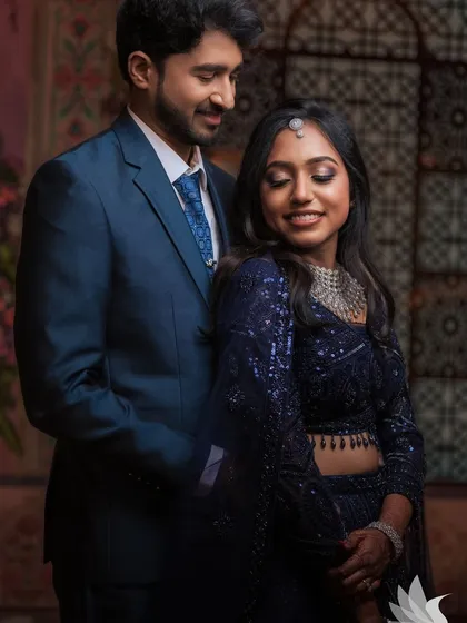 A romantic close-up of the couple. Dr. Akshara's glam eye makeup and radiant smile are the focus of this beautiful shot.
