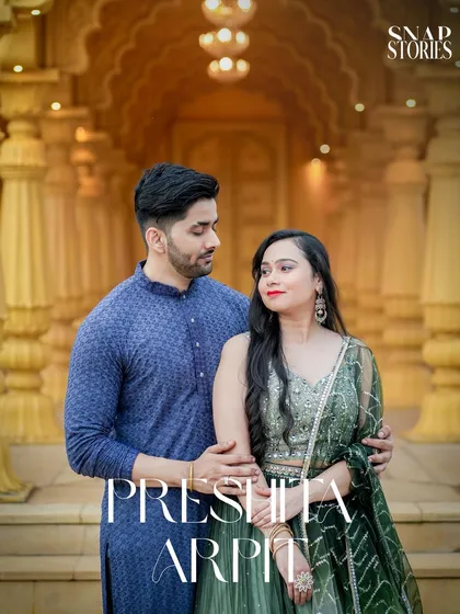 For a touch of royalty, I use heritage locations with intricate designs. This couple's portrait, set against a golden, palace-style backdrop, highlights their traditional attire and creates a timeless, regal photograph.