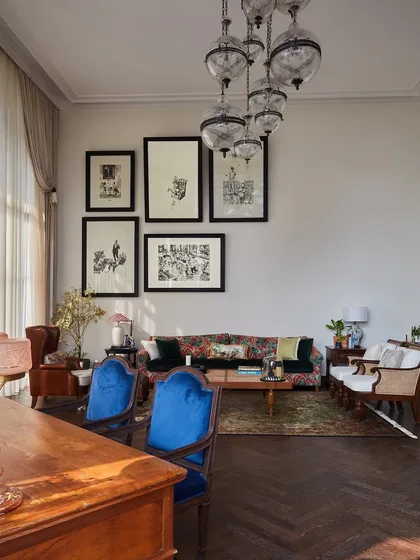 The founder's cabin at Maddock, with its impressive 17 foot ceiling, was a joy to design. I centered the space around a large vintage desk and a custom light installation, layering it with eclectic art from London, a mix of Persian carpets, and vintage chairs to capture a youthful, fun, and subtly opulent spirit.