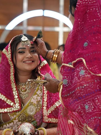 The bride receives a blessing during the prayer ceremony. Our planning ensures that these deeply personal and spiritual moments are honored and cherished.