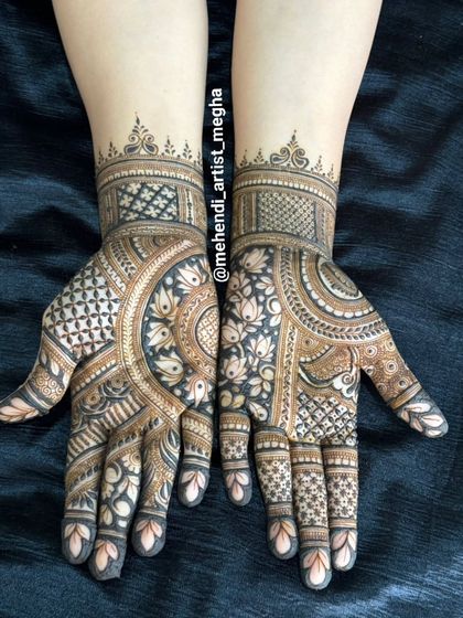 A lovely mix of styles, with one hand featuring delicate lotus patterns and the other showcasing bold, geometric check-work.