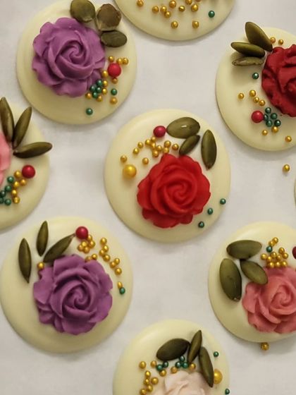 These are my white chocolate mendiants, decorated with colorful chocolate roses, pumpkin seeds, and sprinkles. They are so pretty and make a wonderful addition to any gift hamper.