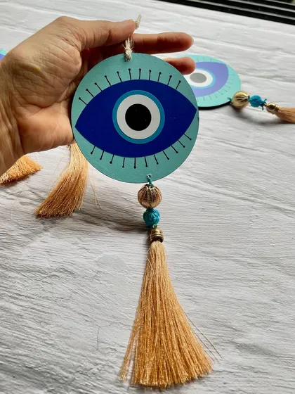These decorative evil eye hangings with tassels were recently made for a client. They are believed to ward off negativity and bring good luck.