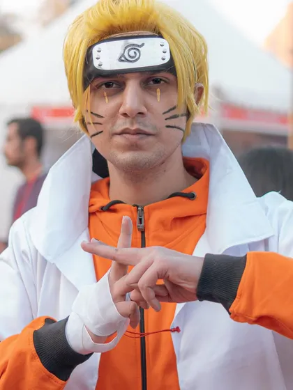 A cosplayer in full Naruto Sage Mode attire, making a classic hand sign for a jutsu. I work with cosplayers to get poses that are true to their characters.