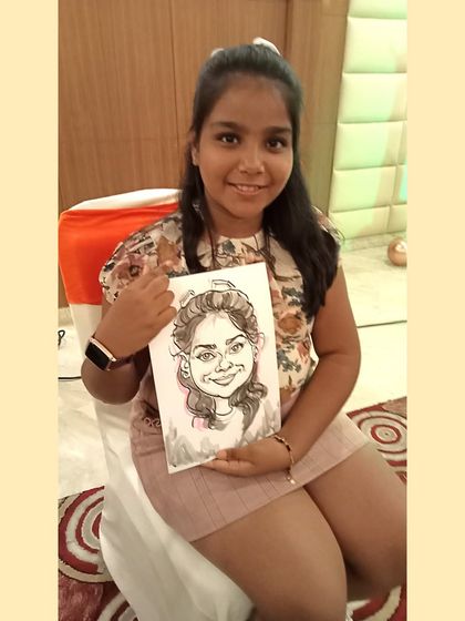 Another happy young guest holding her portrait. I can draw dozens of these at an event, ensuring many guests get to participate.