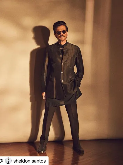 Another powerful stance from the same shoot. The hair remains perfectly in place, contributing to the sharp silhouette.