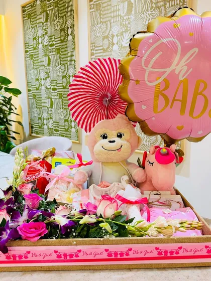 Welcoming a little princess with a hamper as beautiful as her arrival. This arrangement features pink roses, orchids, and a host of baby essentials.