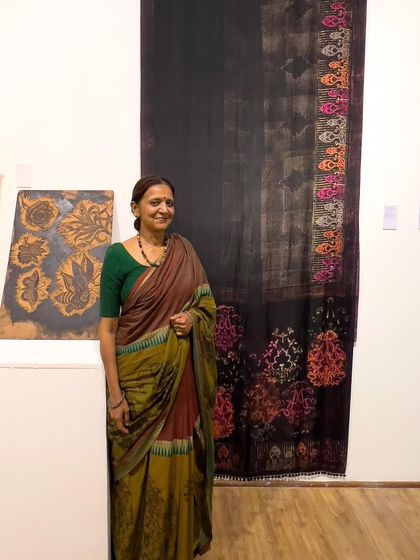 A beautiful hand-printed saree displayed as a textile art panel at the 'Chaap Tilak' exhibit in Kolkata. Our wearable art often doubles as stunning decor, celebrating the heritage of handblock printing.
