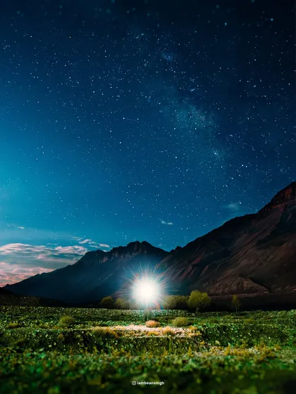 Under the Spiti sky, a single light illuminates a field of stars. I used a long exposure to capture the Milky Way and create this magical, otherworldly scene in Kaza.