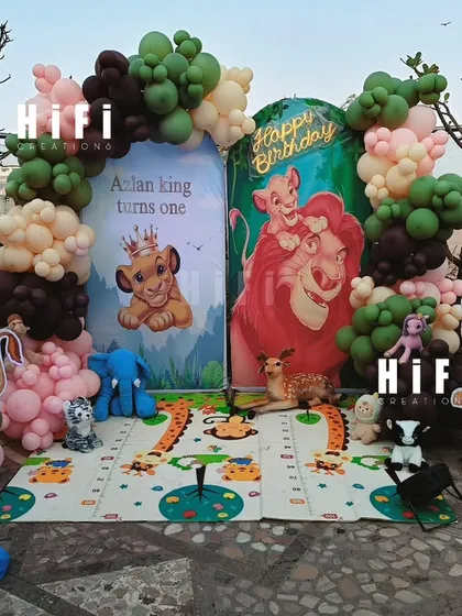 An outdoor Lion King first birthday party. We can adapt our themes for any space, creating a fun and safe play-mat area for the kids.