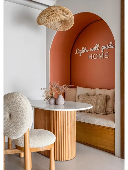 This cozy dining nook is one of my favorite creations. The custom neon sign, "Lights will guide you HOME," is all about creating a space that feels personal and warm, a little corner of the world that’s just for you.