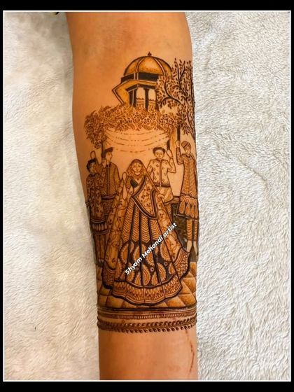 A detailed depiction of a wedding scene on the forearm, complete with family members and traditional elements.