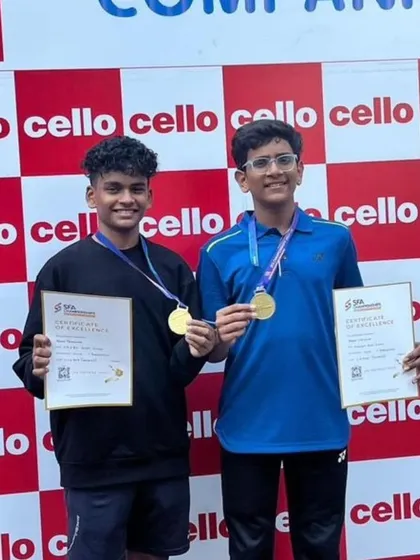 Aarav Chettiar and his partner with their gold medals after winning the U-15 Doubles event at the SFA Championship.