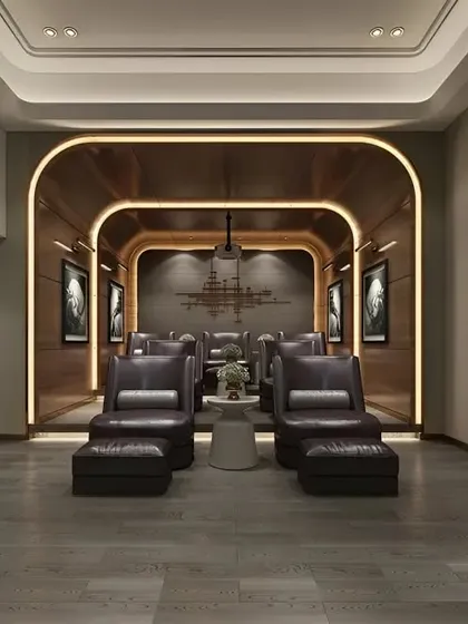 An elegant home theater with an art-deco feel. The design features curved wood paneling, luxurious leather armchairs, and a dedicated bar area, creating a stylish space for entertainment.