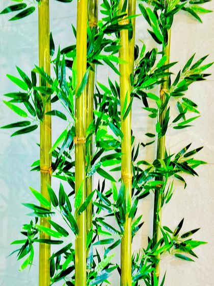 Another detailed shot highlighting the vibrant green leaves and glossy finish of the bamboo stalks. This level of quality ensures the installation looks fresh and realistic for years.