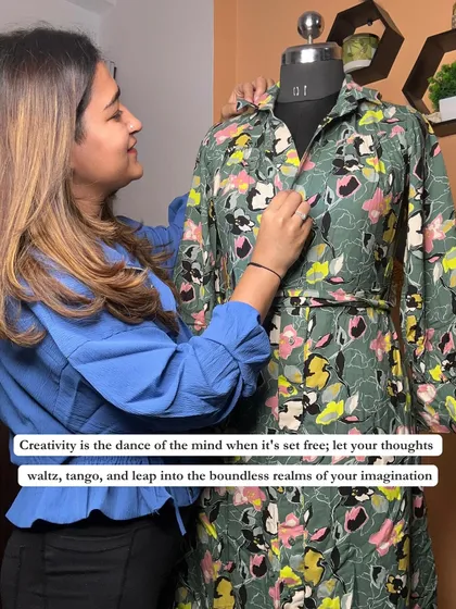 Creativity is the dance of the mind. Here I am, working on a mannequin, bringing a creative vision to life by styling a floral print dress.