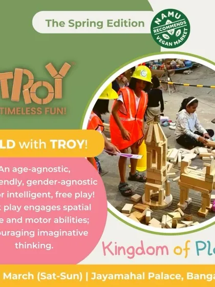 A visual feature of the "Build with TROY" activity, showing kids in hard hats fully engaged in construction play.