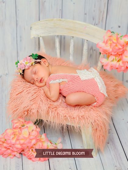 A wider shot of the pink floral theme, showing the full setup with the miniature chair and surrounding flowers. This highlights the complete, curated scene we create in our studio.