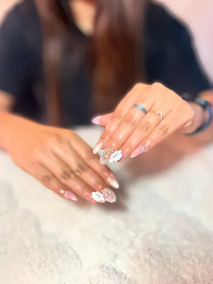 Intricate white lace and floral designs that are perfect for weddings or elegant events. Mastering this delicate work is a valuable skill for any nail professional.