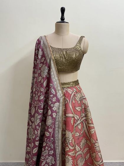 A closer view of the floral lehenga set, showing the gold sequin blouse and the intricate print on the dupatta.
