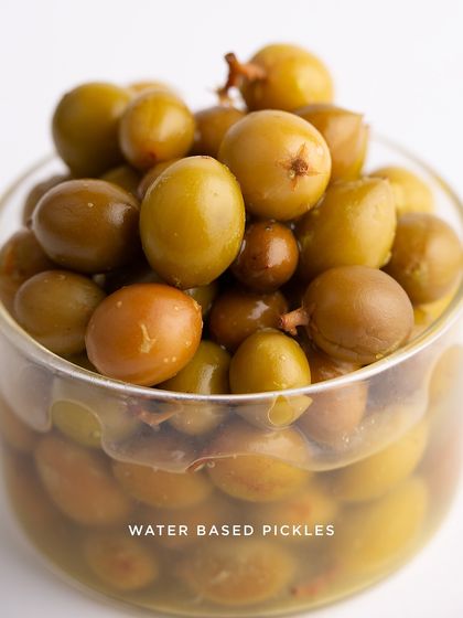 This is our Pickled Karvanda, a unique water-based pickle. These seasonal berries, also known as Carandes Plum, are preserved in a natural brine to develop a distinct sour and salty taste.